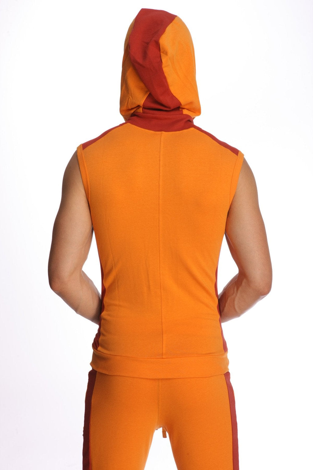 Sleeveless yoga hoodie in sun orange with snug fit hooded sleeveless top and matching pants in bold color contrast