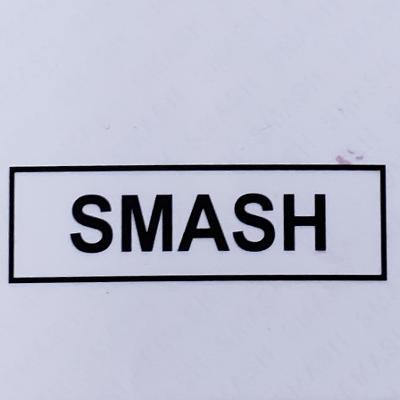 Black smash novelty top sticker with bold uppercase lettering inside a simple rectangular border