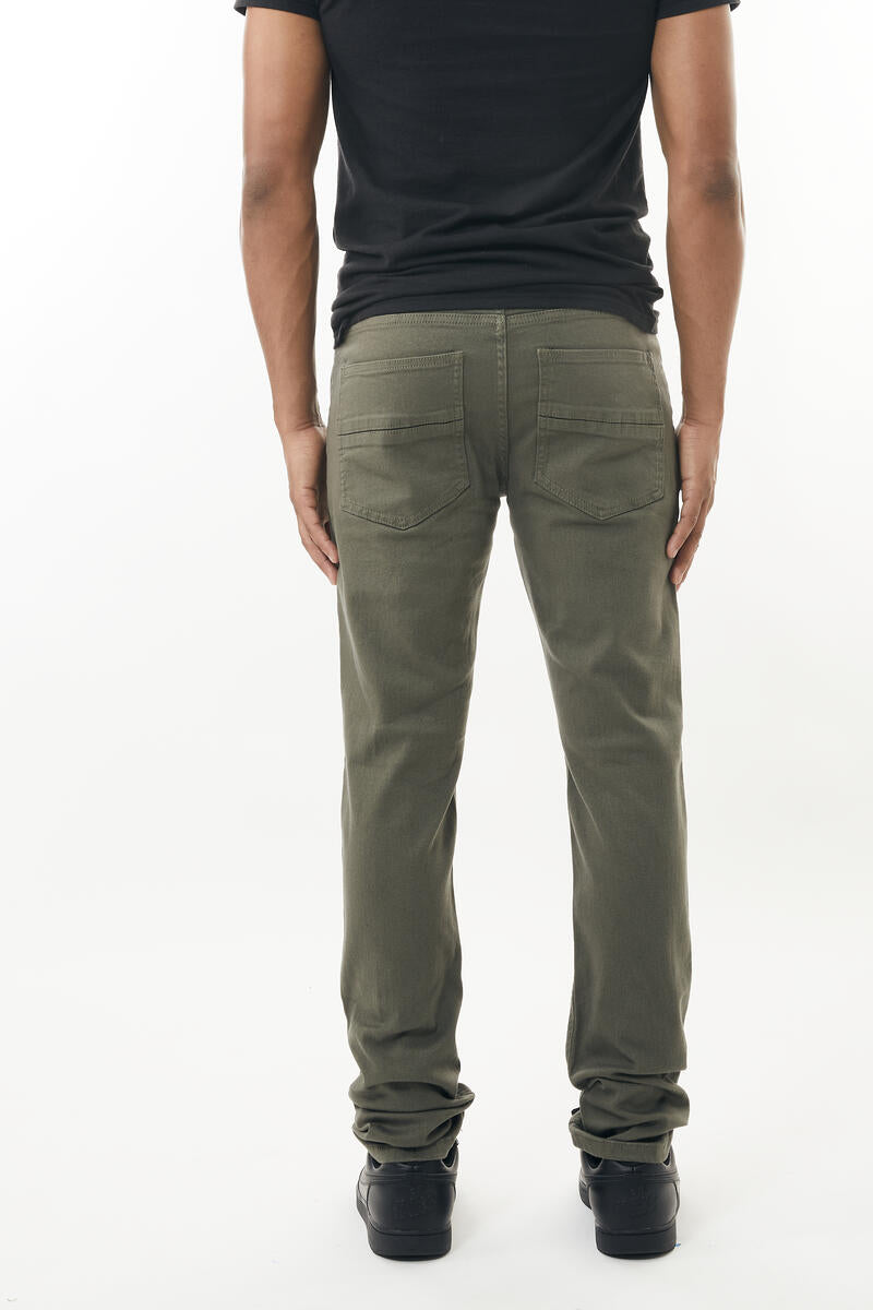 Olive green stretch twill pant straight-leg denim jeans with rear pockets and rolled cuffs shown from the back side