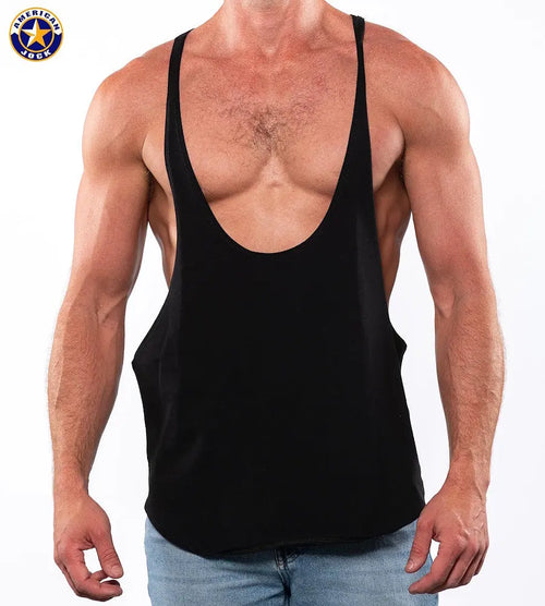 Black bodybuilding string tank top by AMERICAN JOCK featuring a deep scoop neck and wide armholes shown on a muscular model.
