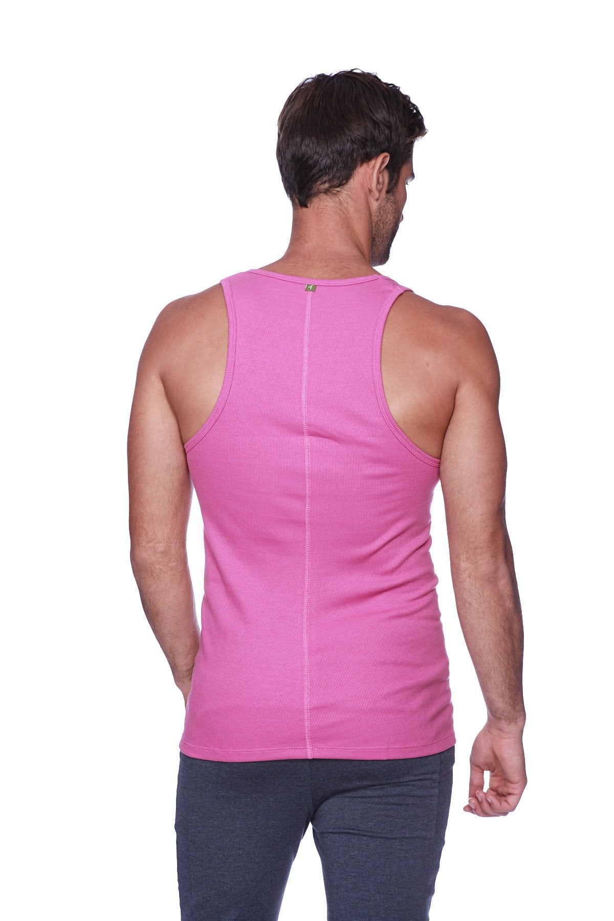 A vibrant berry pink sleeveless sustain tank made of smooth stretchy fabric showing the back with a central seam