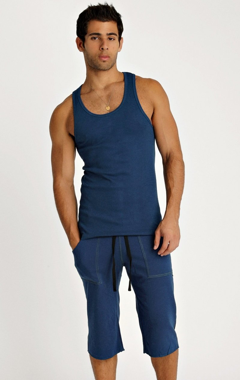 Men’s navy blue sleeveless Sustain Tank with rounded neckline and matching capri-length shorts for active wear