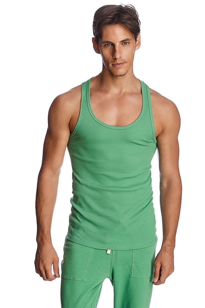 Green ribbed cotton sustain tank top with scoop neckline paired with matching green pants in bamboo green