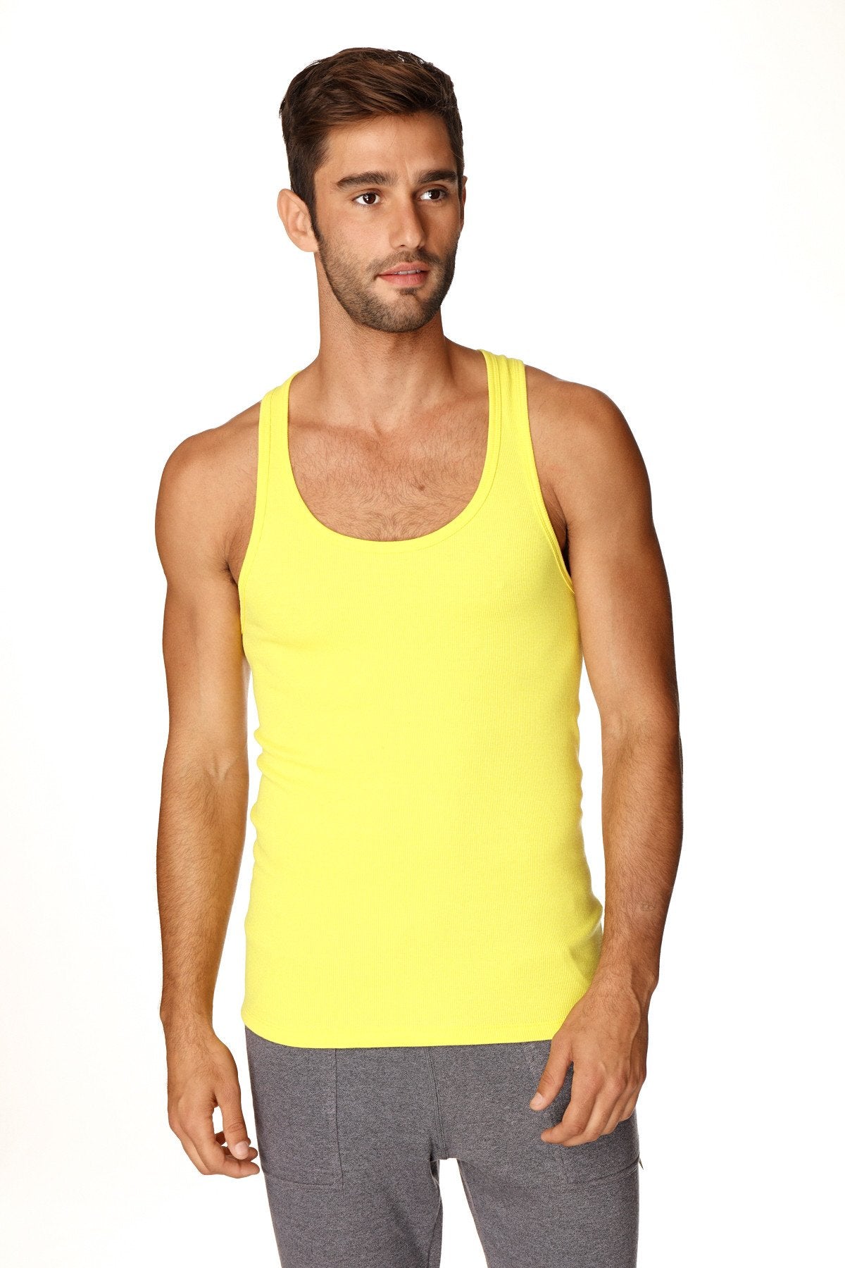 Bright yellow sleeveless Sustain tank top in a fitted design made from sustainable fabric perfect for casual wear