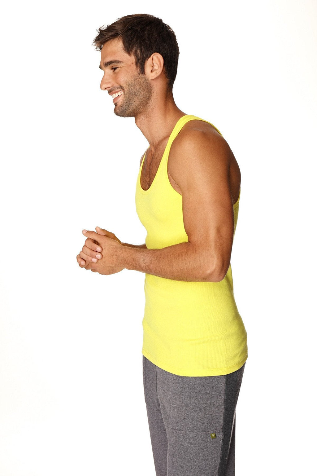 Bright yellow sleeveless sustain tank top with rounded neckline and fitted cut in tropic yellow color