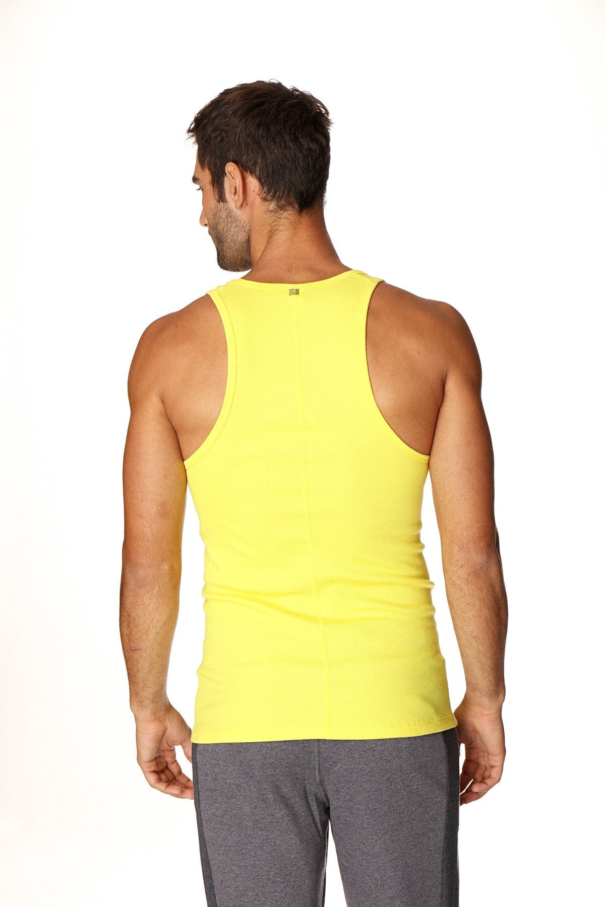 Bright yellow sleeveless sustain tank top in breathable fabric designed for athletic and casual wear
