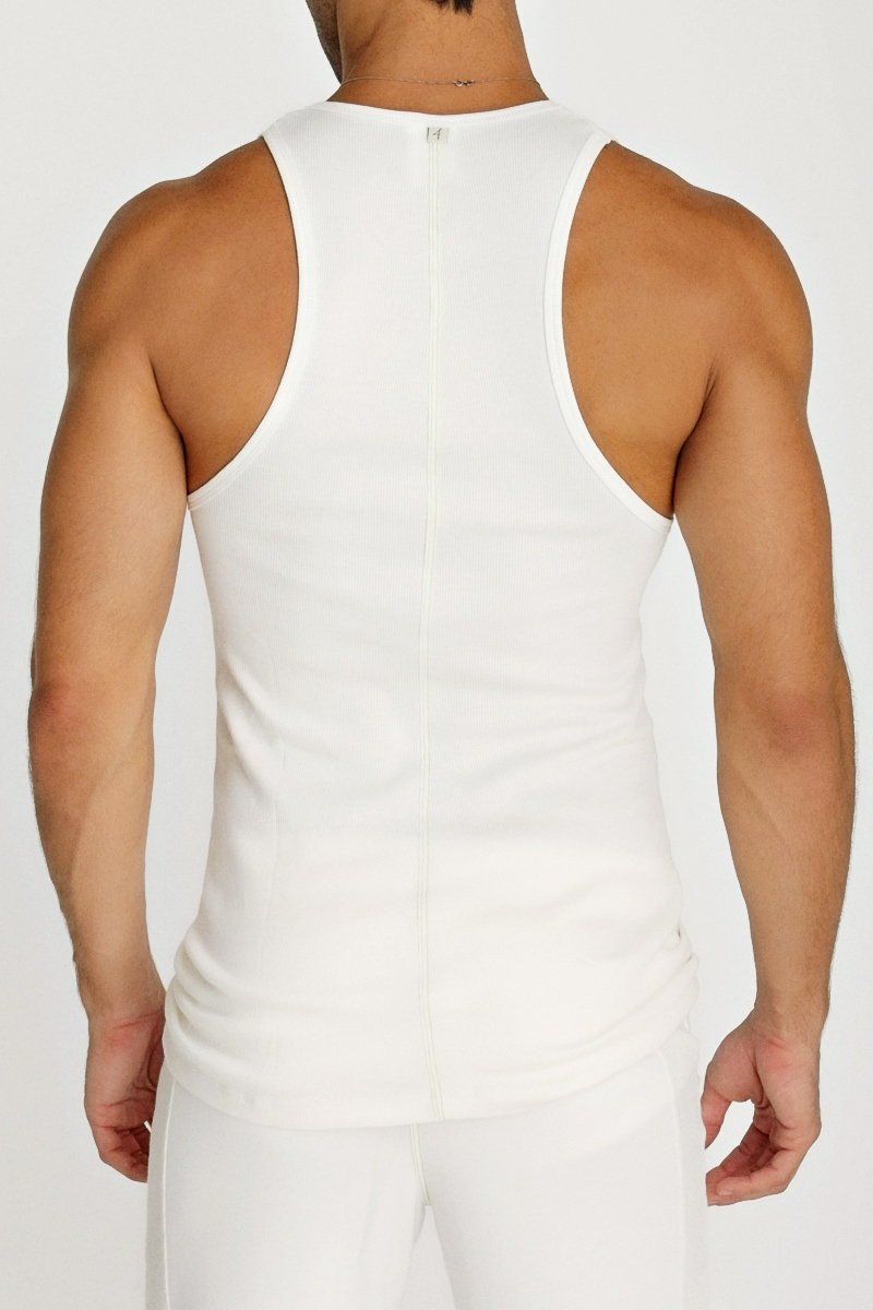 Back view of white sleeveless sustain tank top with central zipper and fitted athletic design