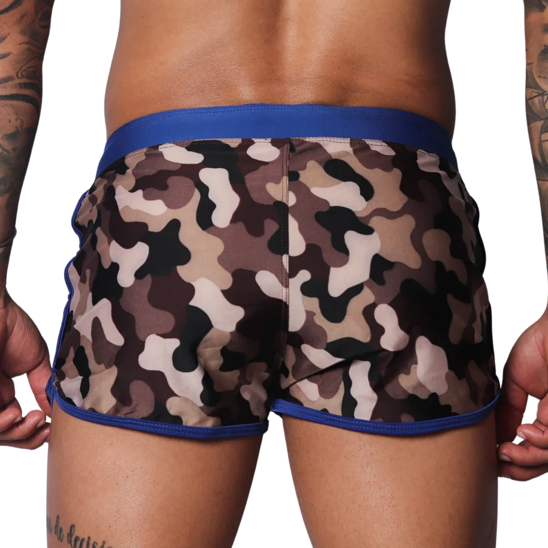 Men's camouflage beach shorts with a solid blue elastic waistband and blue trim on the curved side hems.