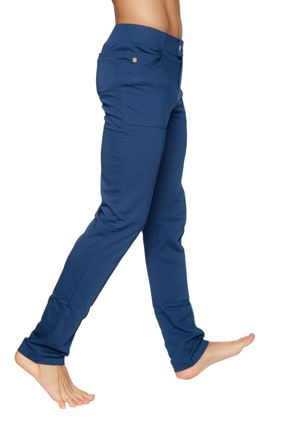 Back side of navy blue tactical urban slim-fit dress and yoga pants with subtle textured fabric and gold-tone brand patch