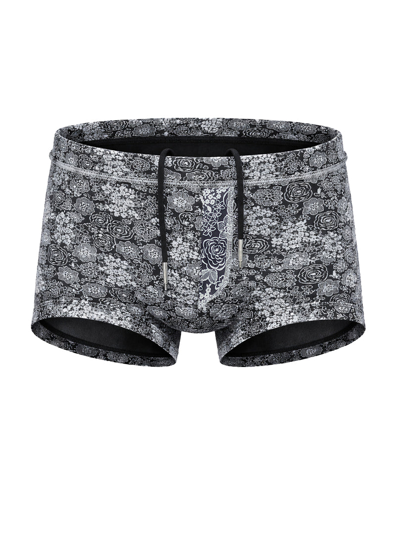 Black and white floral patterned tartarus swim trunk with drawstring waistband for comfortable beachwear