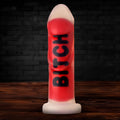 Red and white silicone dildo with the word bitch printed in black from the Explicit Text Silicone Dildo product line