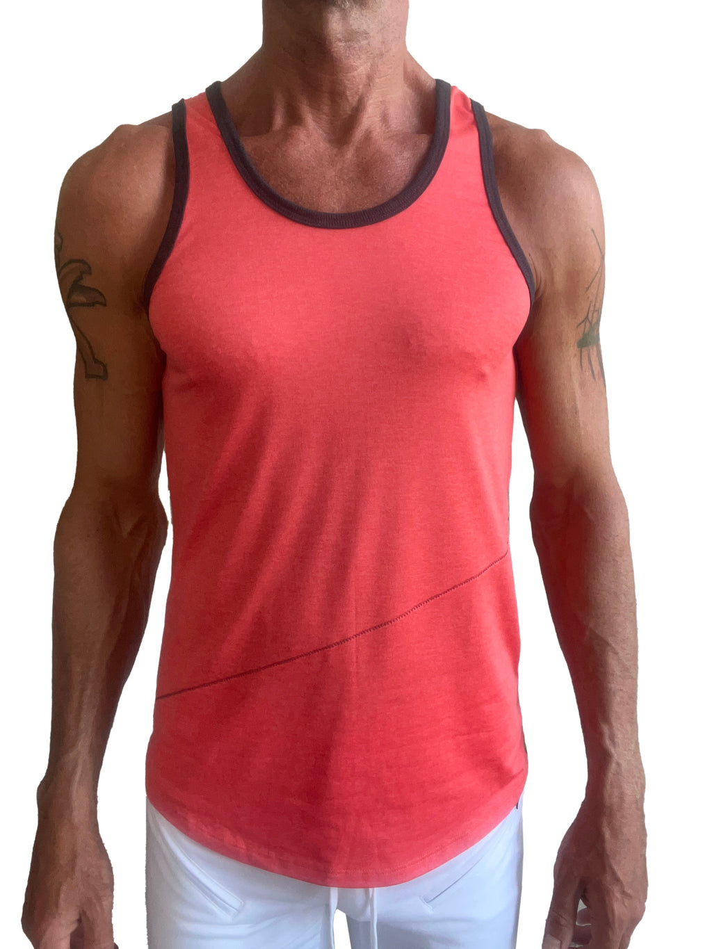 A coral tank top with black trim and diagonal seam detail called the perfect tank coral