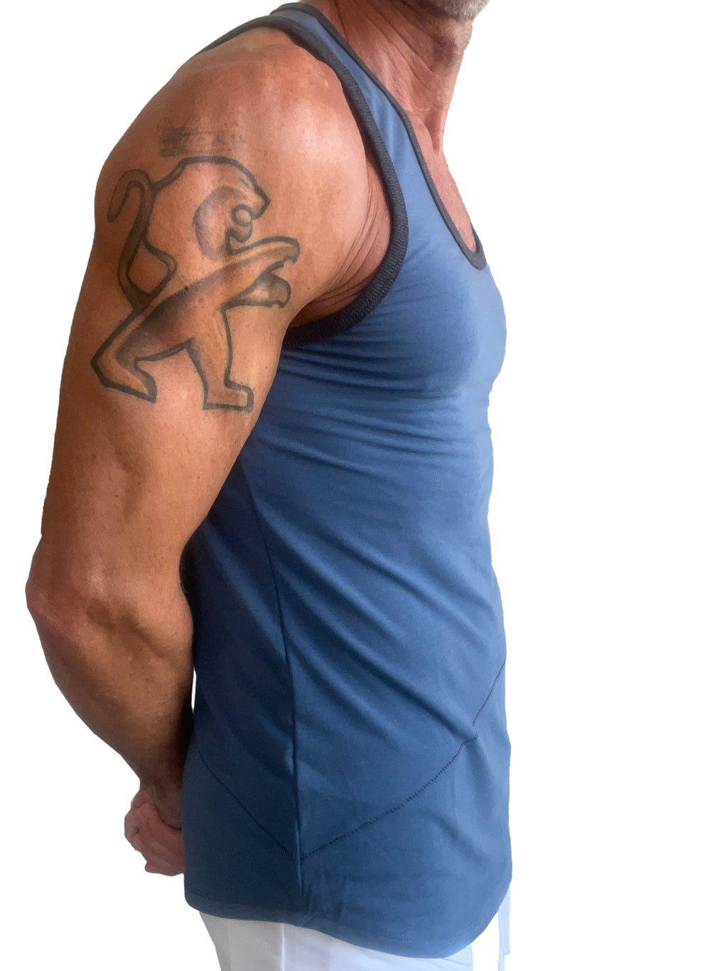 Blue athletic tank top with black trim and subtle geometric panels from the perfect tank denim blue collection