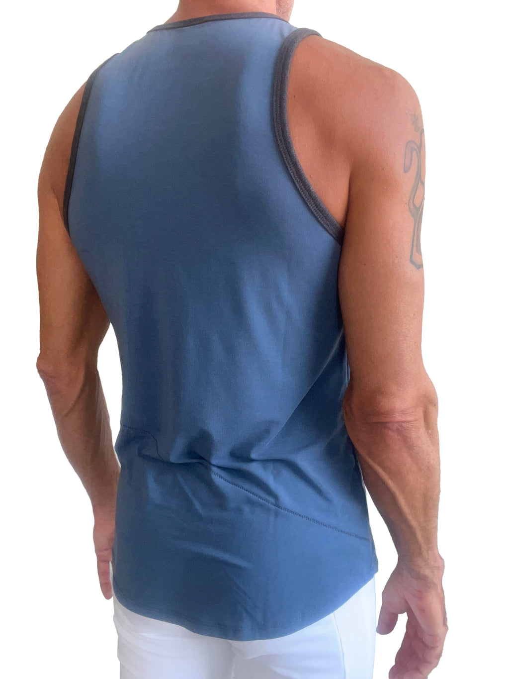 Blue athletic tank top called the perfect tank denim blue with dark gray trim along neckline and armholes