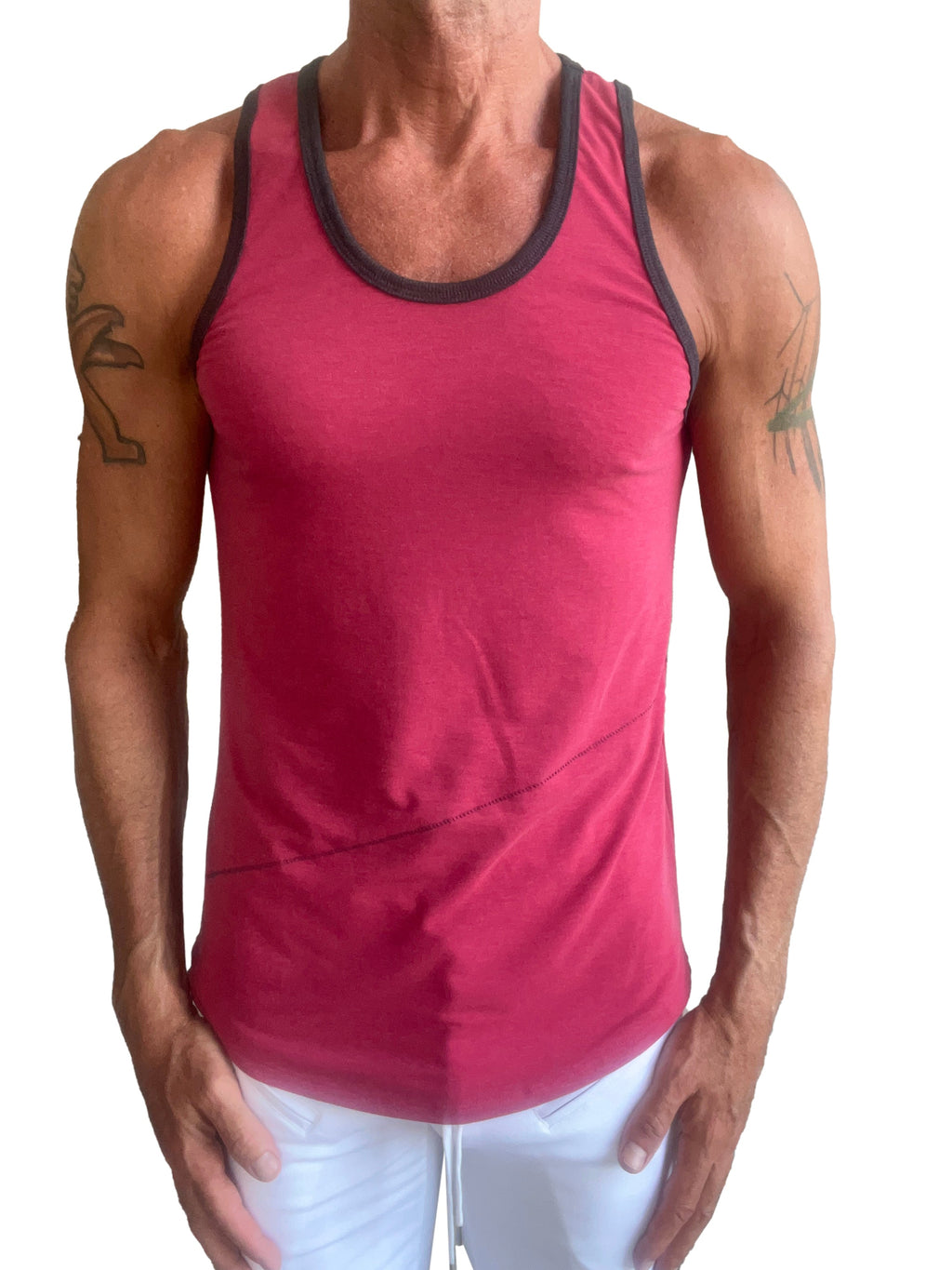 A men’s red tank top with black trim around the neckline and armholes called the perfect tank raspberry