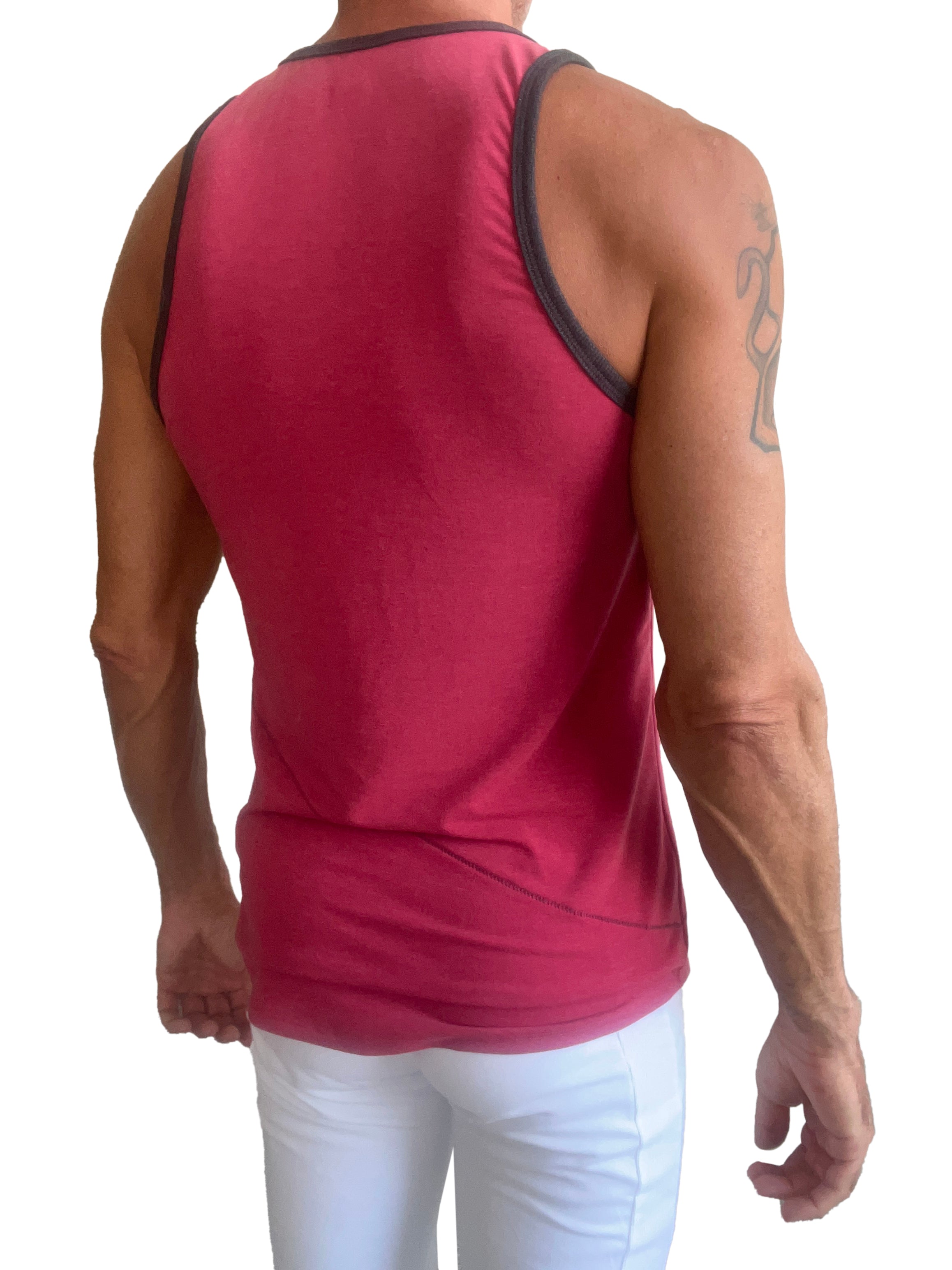A vibrant raspberry sleeveless tank top with black trim along the neckline and armholes called The Perfect Tank
