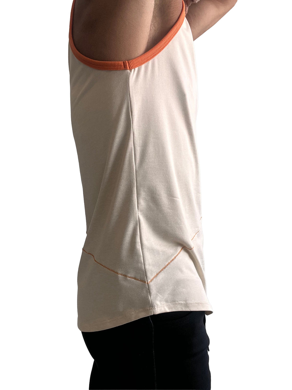 Cream-colored sleeveless tank top with orange ribbed neckline and matching hem stitching in sand beige