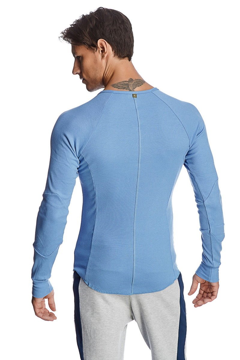 Light blue thermal v neck long sleeve shirt with ribbed texture and central back seam shown from the back side
