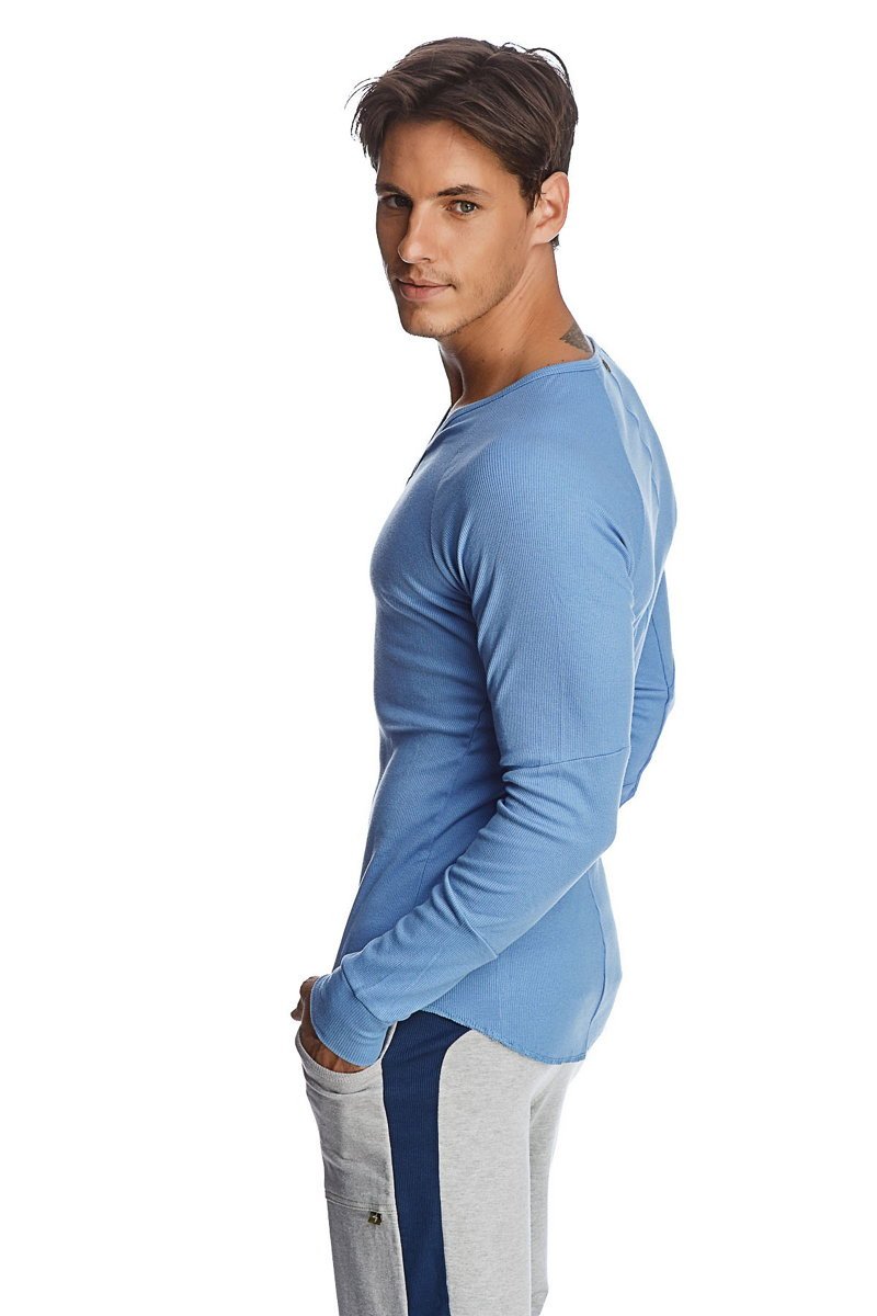 A light blue ribbed knit shirt with long sleeves and a rounded neckline called thermal v-neck long sleeve ice blue
