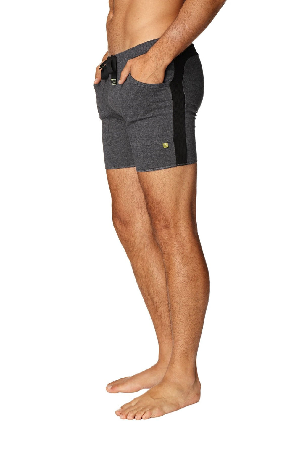 Transition yoga short charcoal with black is a dark gray athletic short with black side panels and a drawstring waistband