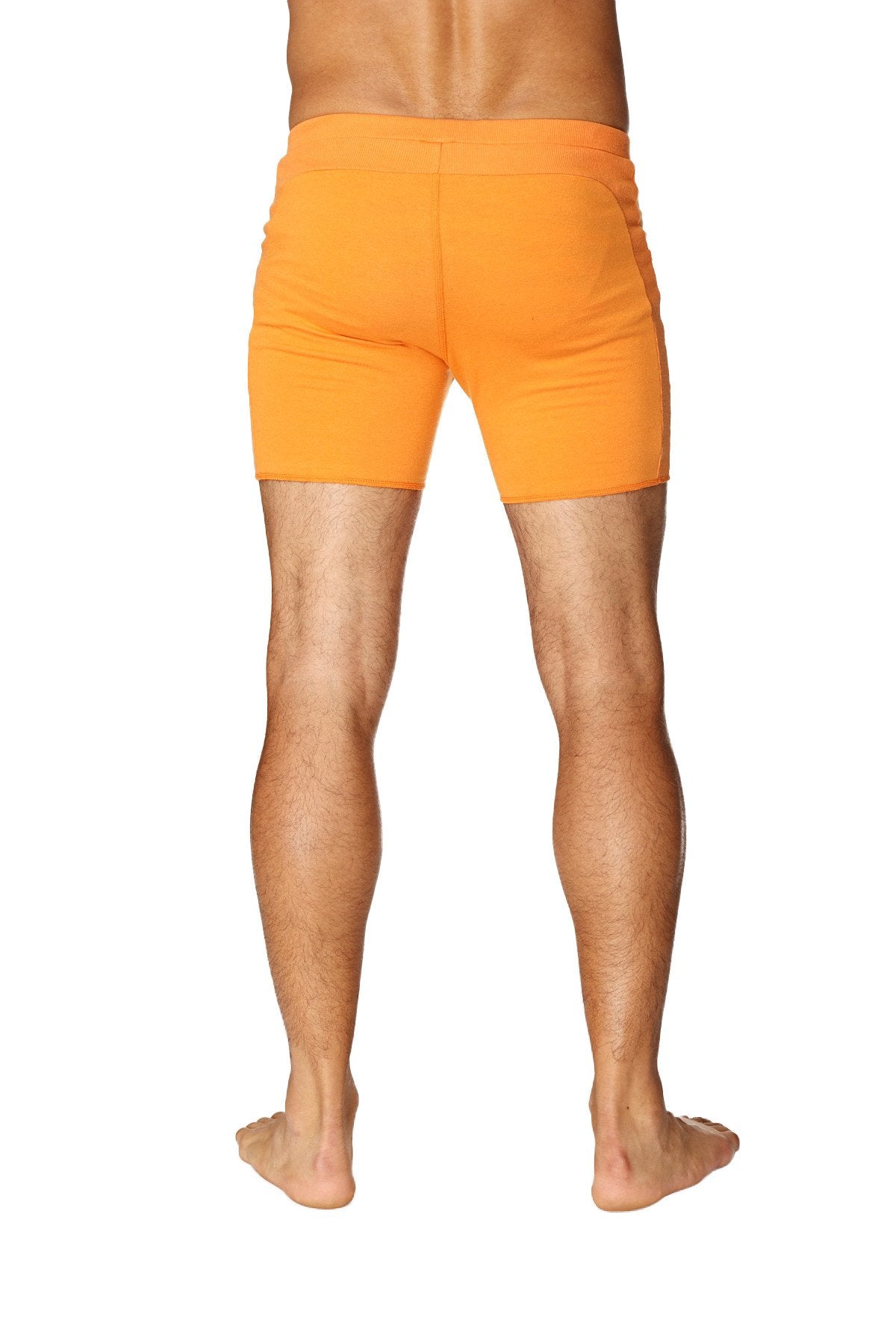 Bright orange transition yoga shorts with smooth fabric finish and form fitting design for athletic use