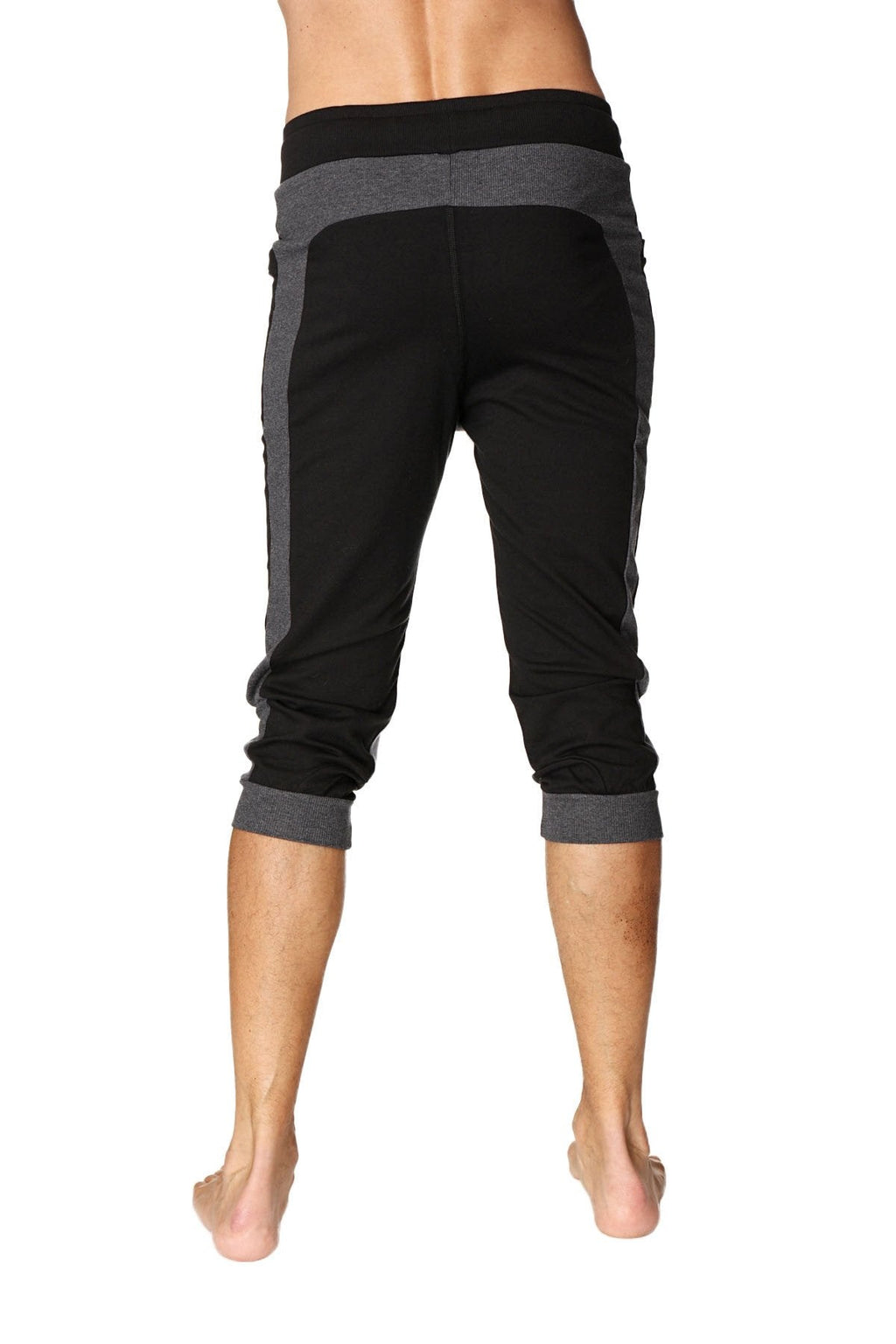 Black and gray ultra-flex tri-color cuffed yoga capri pants with ribbed waistband, heathered side panels, and rolled cuffs