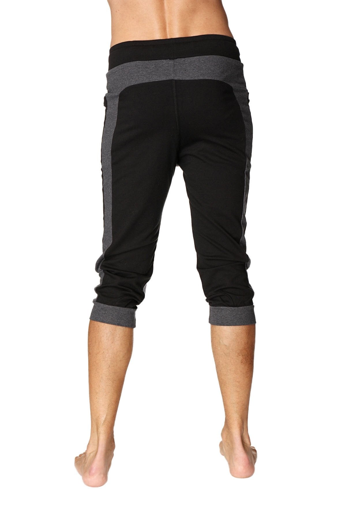 Black and gray ultra-flex tri-color cuffed yoga capri pants with ribbed waistband, heathered side panels, and rolled cuffs