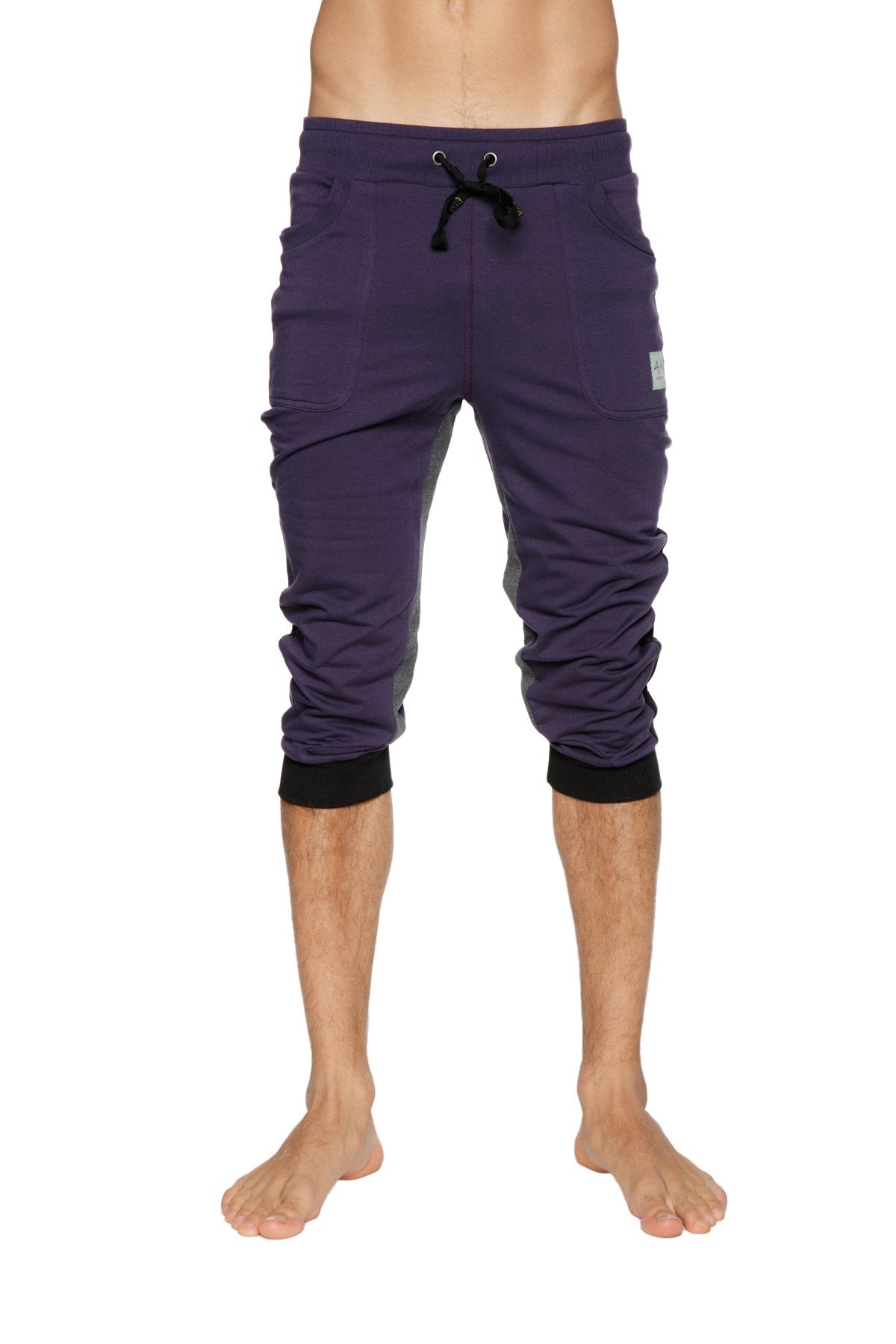 Ultra-flex tri-color eggplant capri-length yoga pant with black drawstring waistband and ribbed cuffs