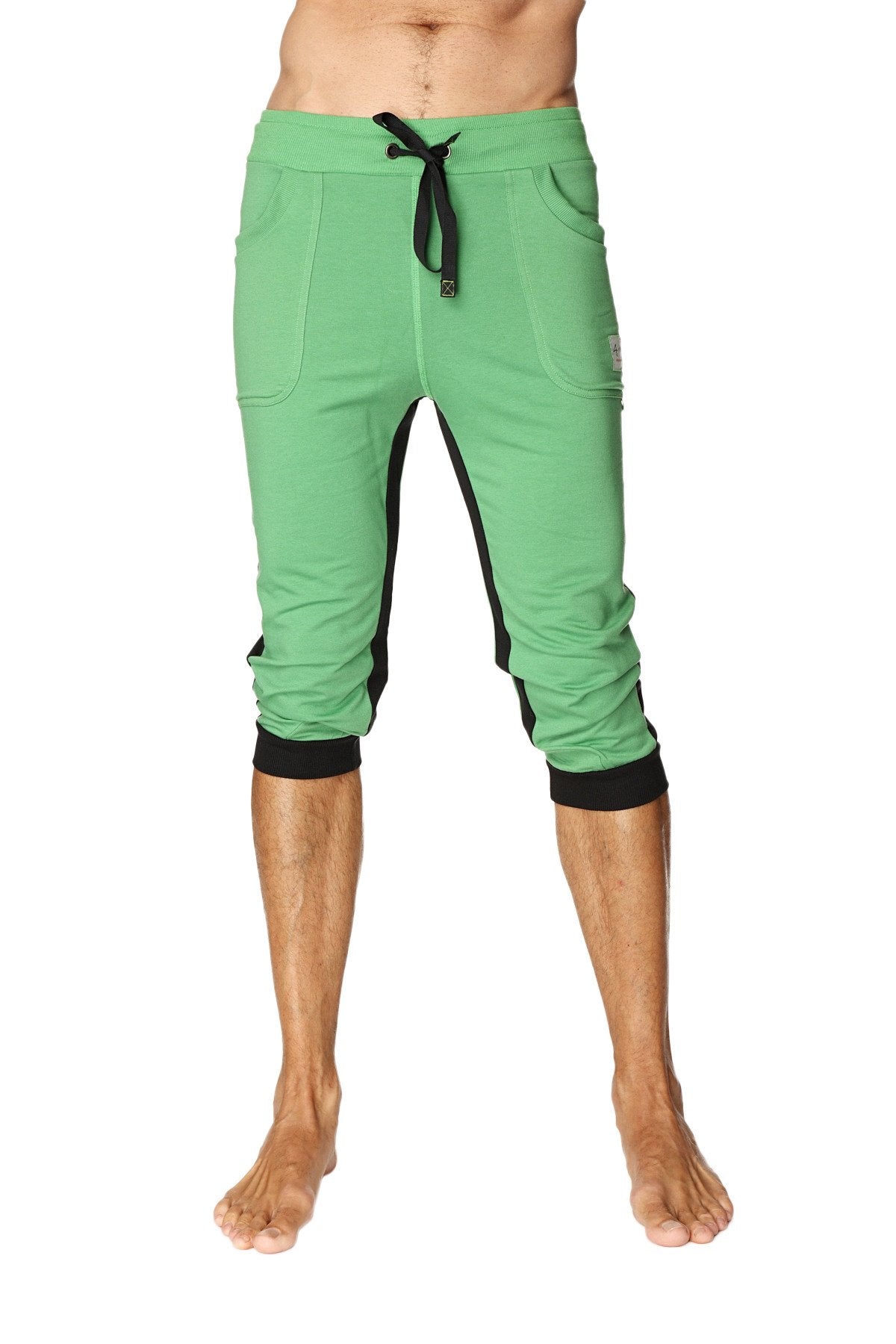 Green ultra-flex tri-color cuffed yoga pant with black side panels elastic cuffs and capri-length joggers style