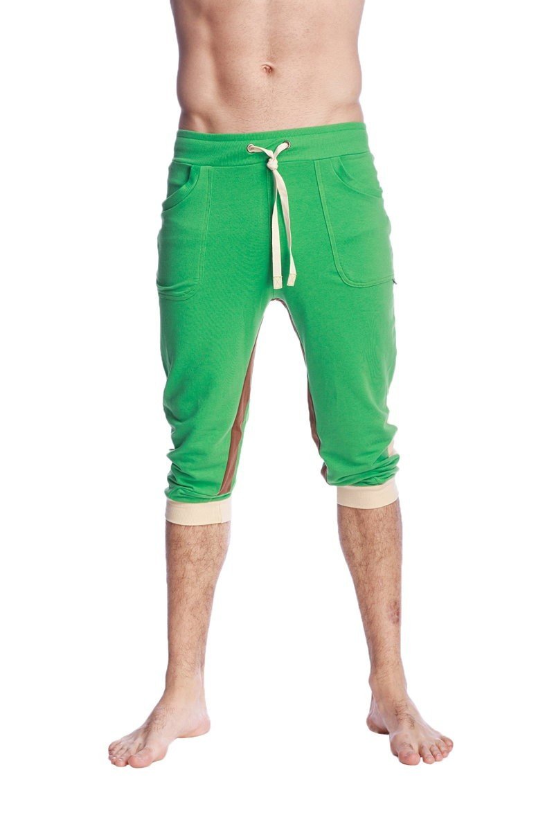 Green ultra-flex tri-color cuffed yoga pant featuring capri-length joggers with beige drawstring and matching cuffs