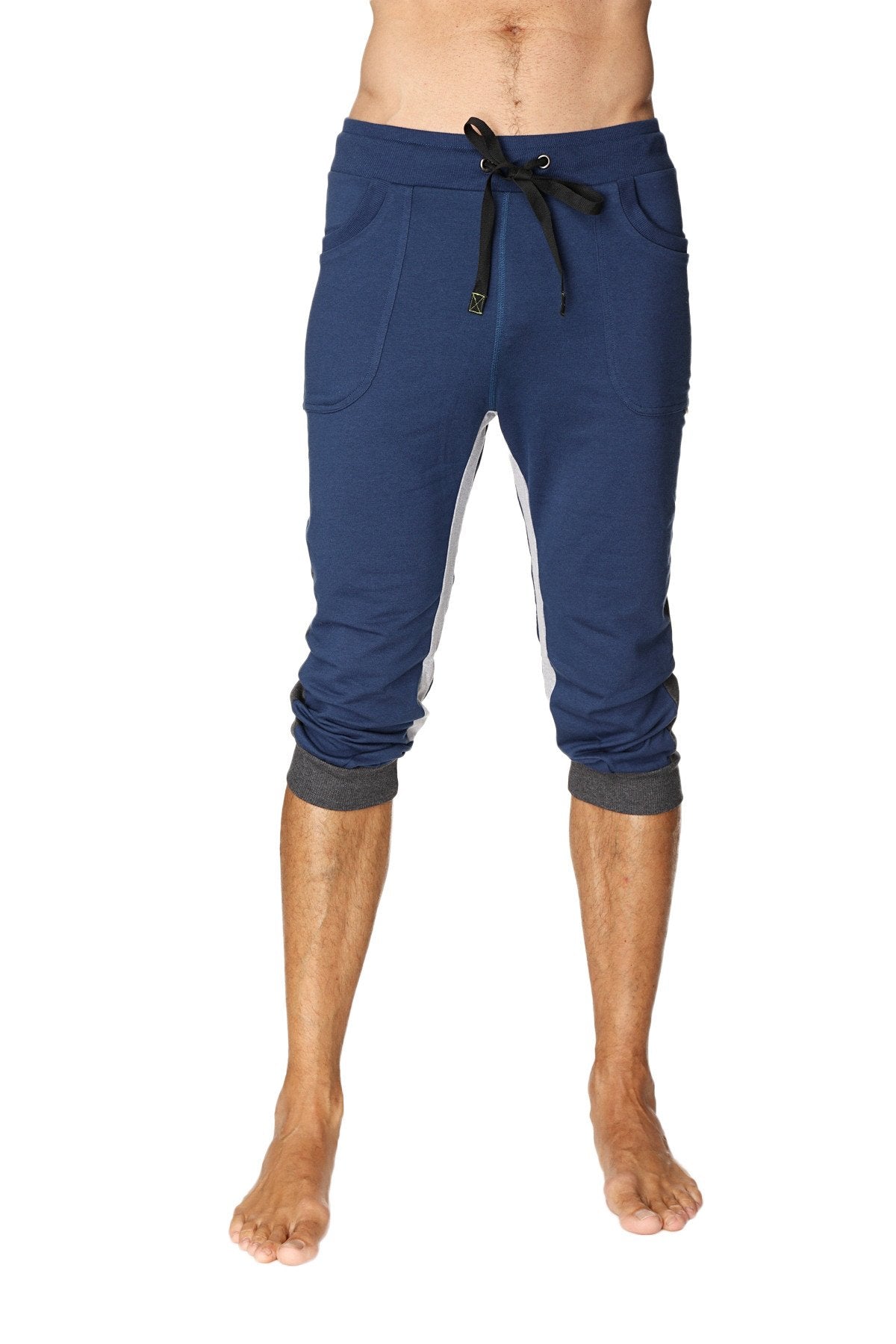Ultra-flex tri-color cuffed yoga pant in navy blue with white side panels and black drawstring waistband, capri length