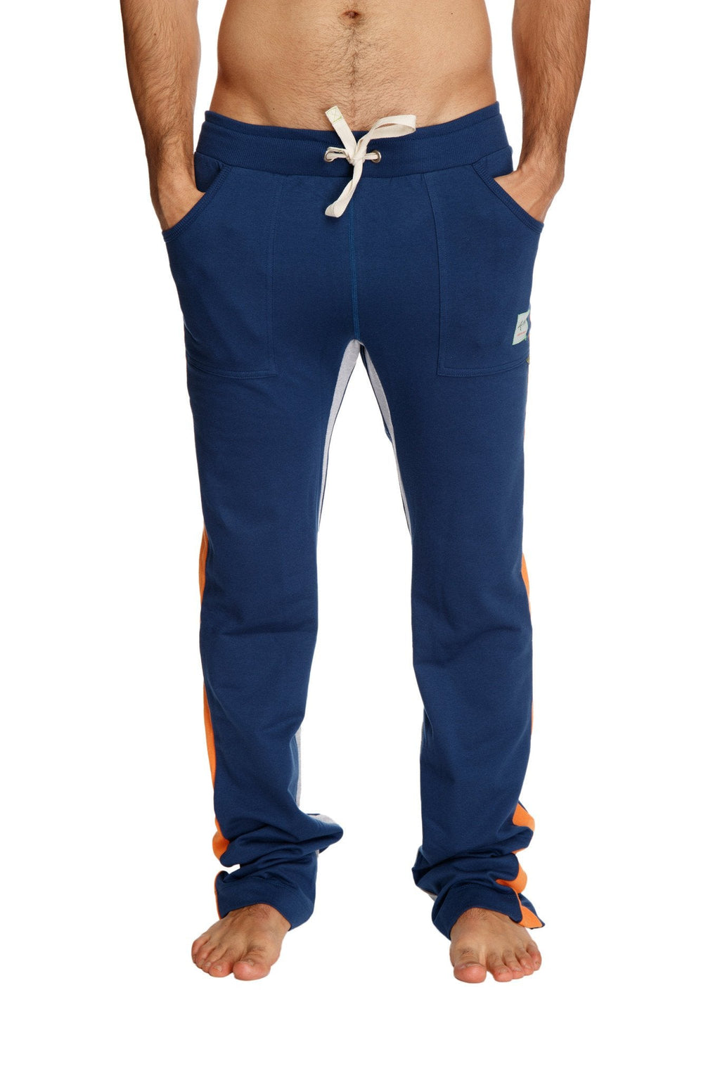 Ultra flex yoga track sweatpants in navy blue with orange side stripes and white drawstring waistband for comfort