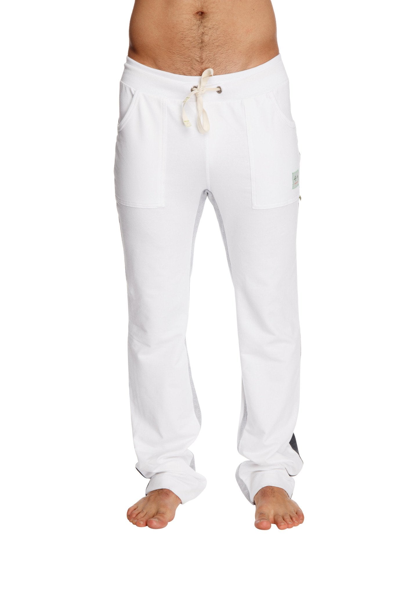White ultra flex yoga sweatpant with drawstring, side pockets, small brand tag on thigh for flexible workouts