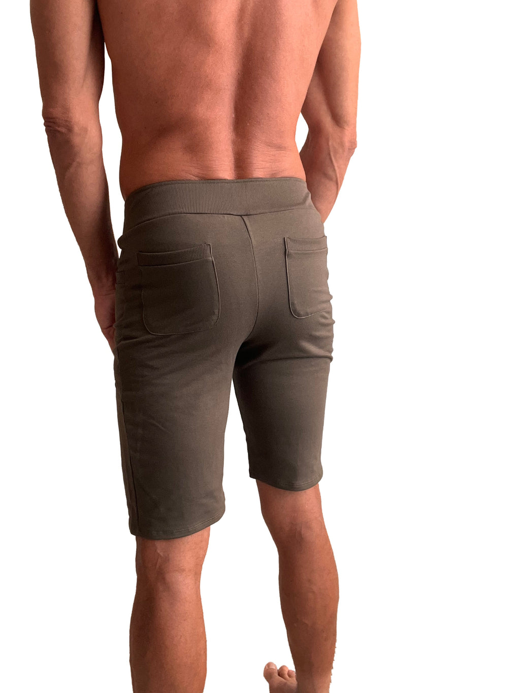 Back side of olive green urban tactical at home dress shorts with ribbed waistband and two back pockets