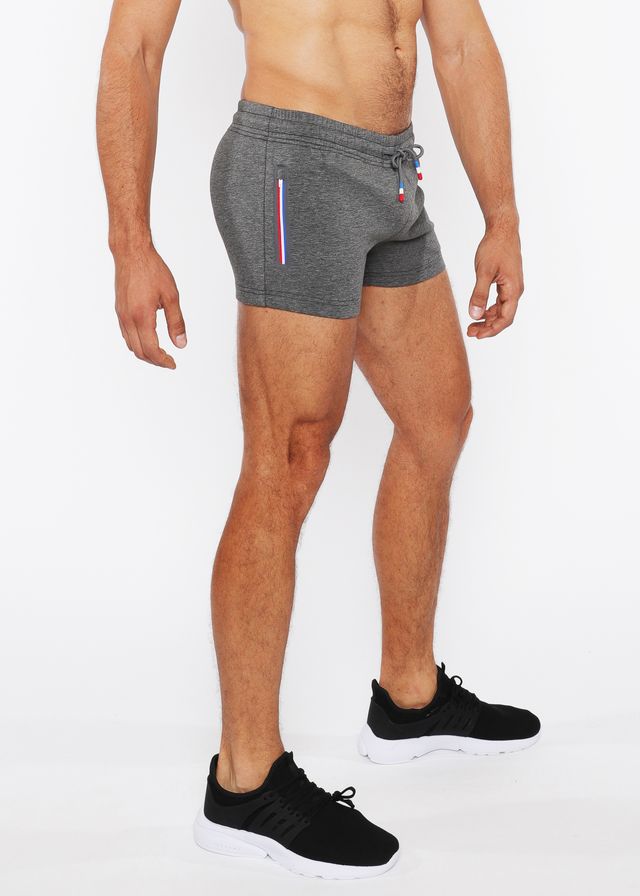 Gray vault gym-tech athletic shorts with drawstring waistband and red white blue heat weld zippers on side stripe
