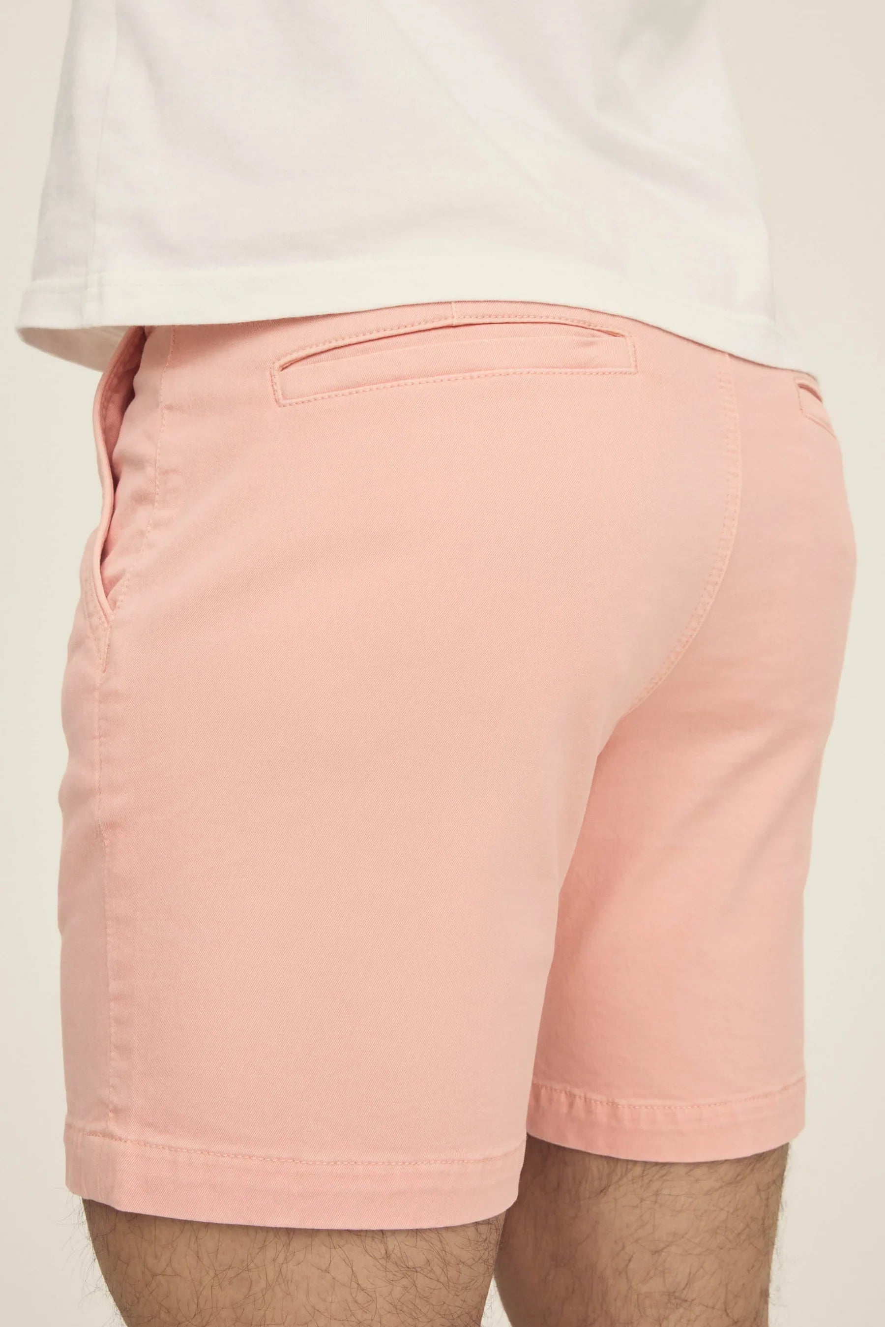 Warp + Weft Denim Act Chino Short in pink, rear view, showing single welt back pockets.