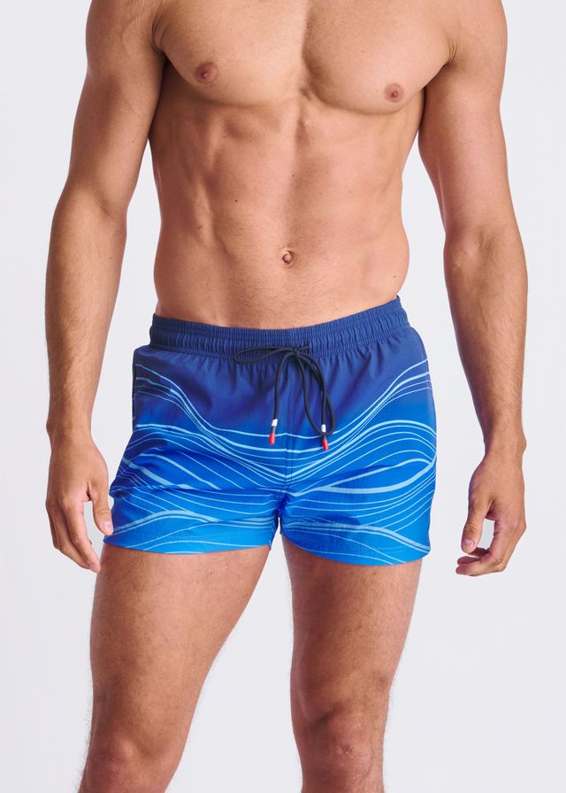 Blue swim shorts with white waves print black drawstring and mesh lining perfect for swimming and beachwear