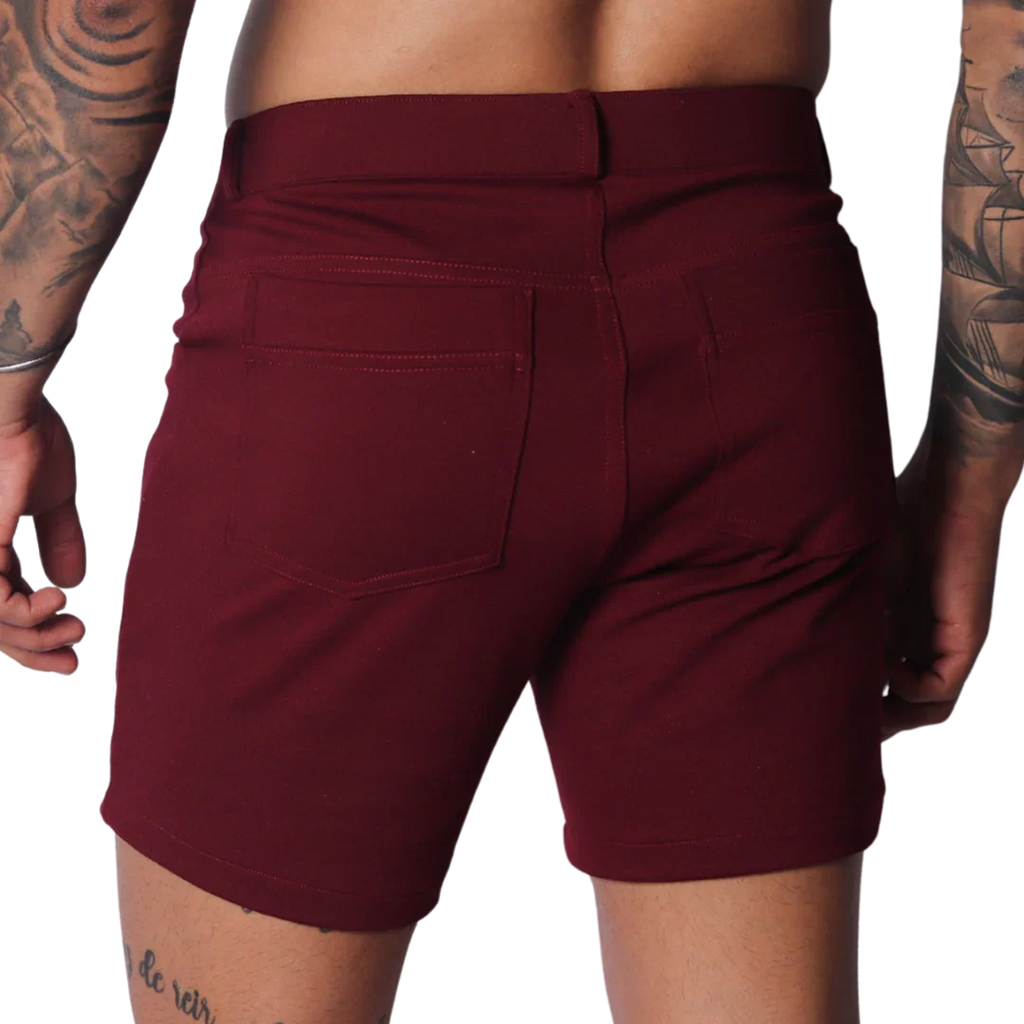 Wine-colored fitted shorts featuring a classic five-pocket design, belt loops, and smooth stretch fabric.
