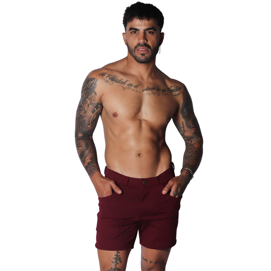 Wine-colored tailored shorts featuring a flat front, button closure, and slim-fit silhouette.