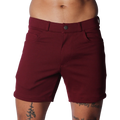 Wine-colored tailored shorts with a structured waistband, button closure, and classic five-pocket design.