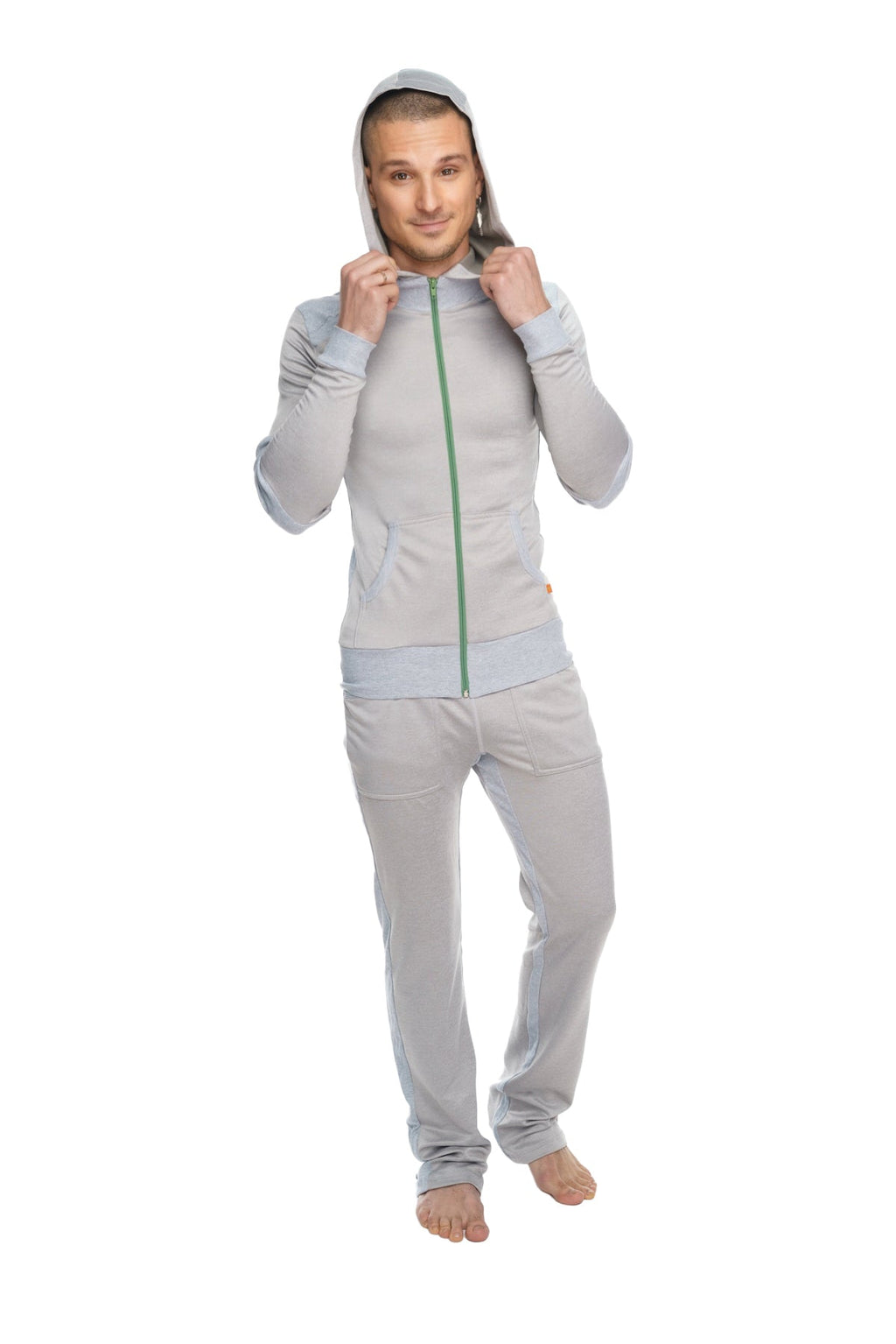 A light gray mid-weight fleece full-body tracksuit with green zipper and hood from winter collection