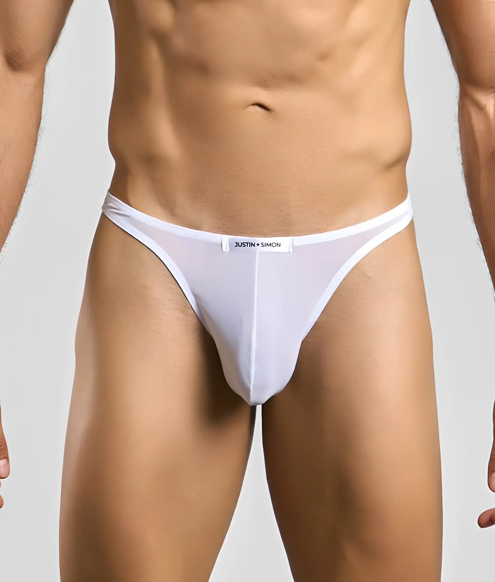 White sheer mesh thong with black justin + simon label on waistband from the justin + simon classic tanga mesh collection