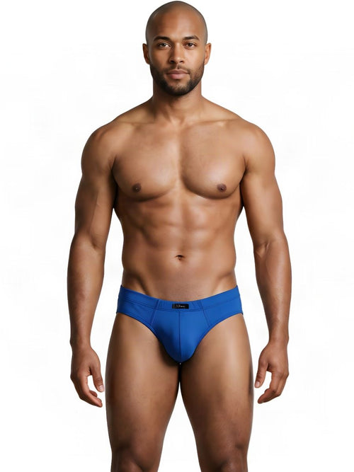 A model wearing Xtremen royal blue microfiber sleek fit briefs against a white background.