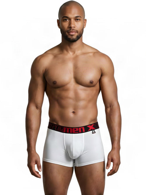 Model wearing white Xtremen microfiber trunks with a black and red logo waistband on a white background.