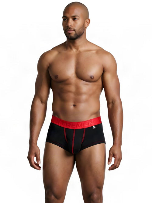 A man wearing Xtremen black athletic briefs with a red waistband and contrasting red stitching.