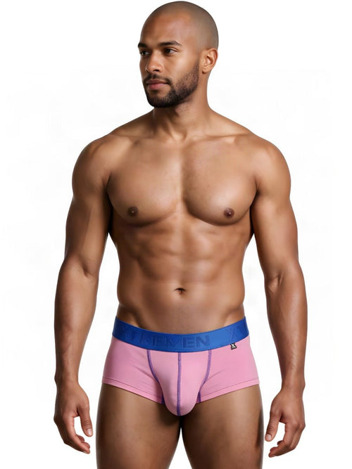 A shirtless athletic man wearing pink Xtremen microfiber briefs with a blue waistband.