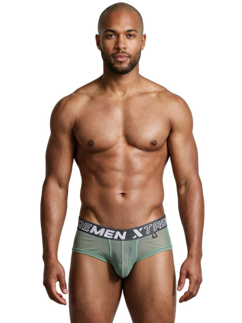 An athletic man wearing green mesh breathable briefs with a branded waistband.