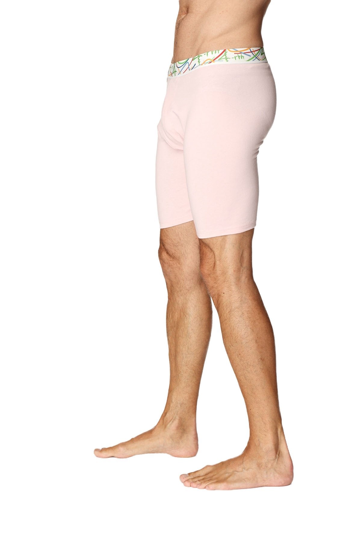 Pink yoga compression shorts with colorful patterned waistband designed for athletic and yoga activities