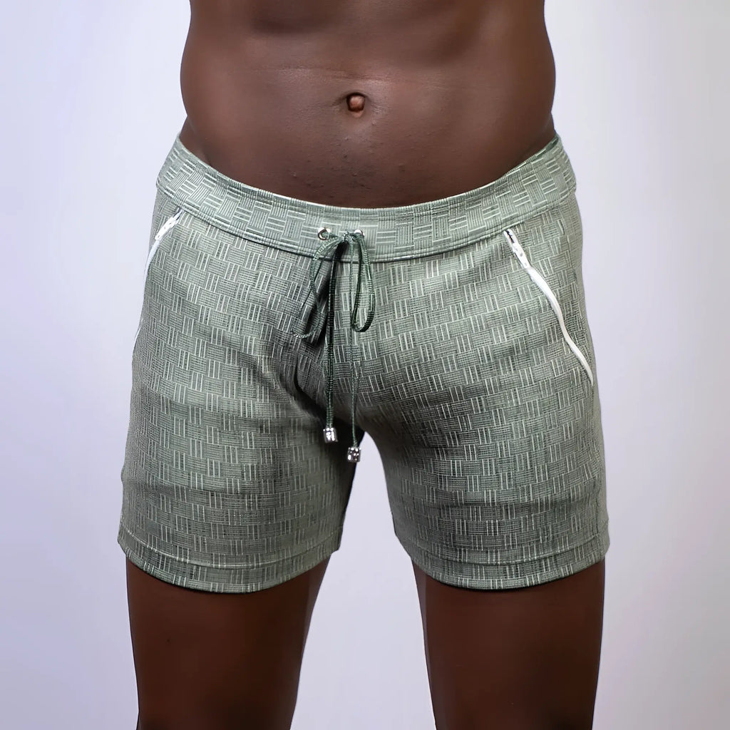 Abstract linen texture shorts in olive green with white zipper accents and a drawstring waistband in linen fabric