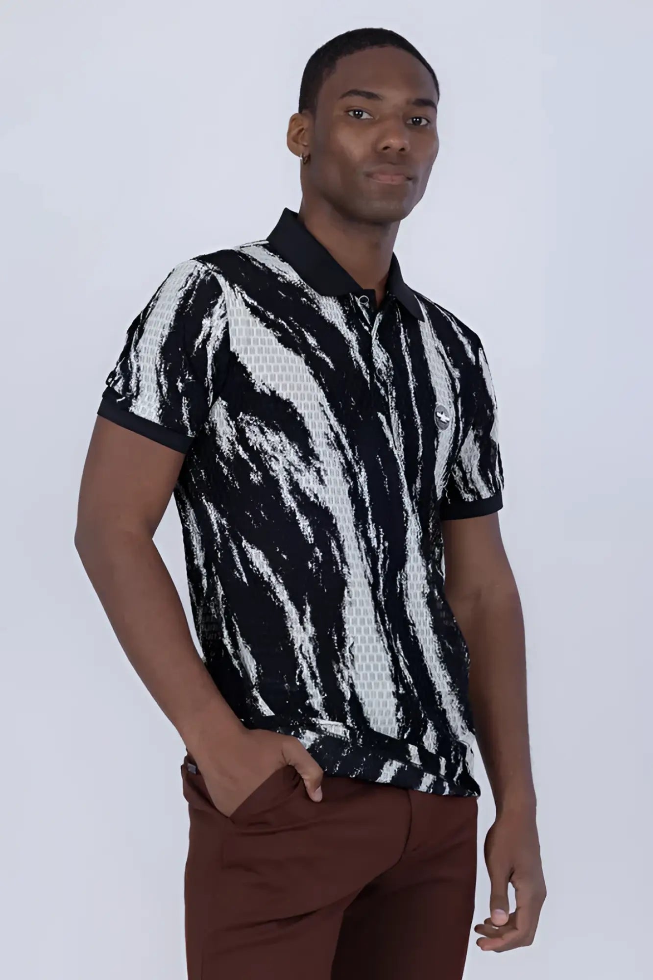 Black and white abstract patterned polo shirt with textured mesh-like design on the torso for casual wear